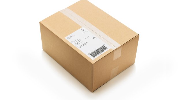 A cardboard box with a barcode label