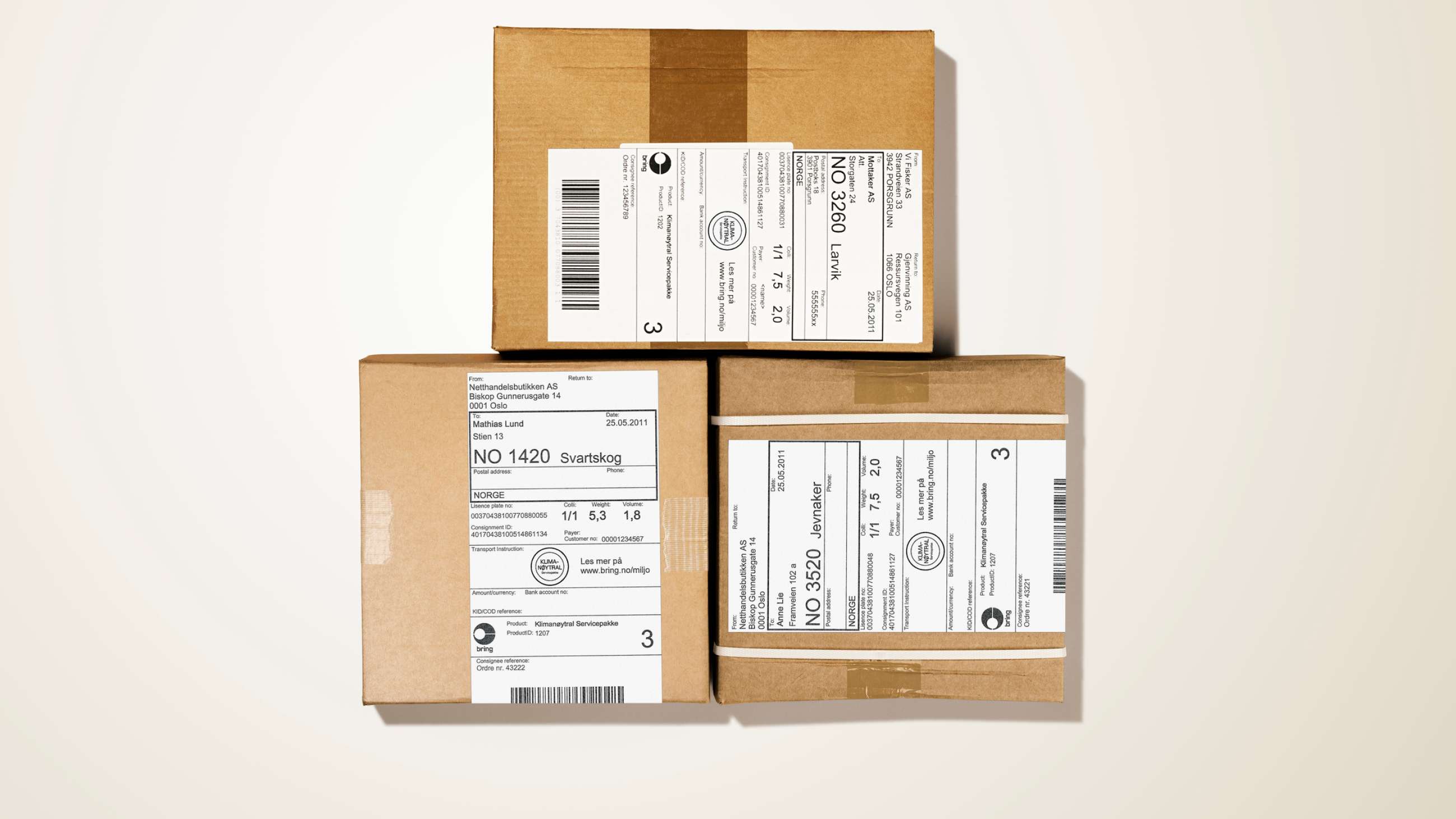Three cardboard parcels with barcodes